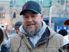 Pat King, one of the organizers of the protest, poses for photos in front of Parliament Hill as truckers and their supporters continue to protest against COVID-19 vaccine mandates in Ottawa, Feb. 16, 2022.