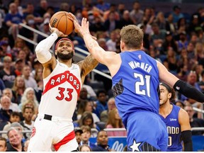 Toronto Raptors guard Gary Trent Jr. shoots the ball over Orlando Magic center Moritz Wagner in the second quarter at Amway Center.