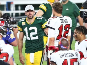ampa Bay Buccaneers quarterback Tom Brady (right) greets Green Bay Packers quarterback Aaron Rodgers (left) after a NFL game at Raymond James Stadium.