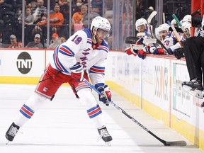 Andrew Copp (18) of the New York Rangers skates with the puck during the second period against the Philadelphia Flyers at Wells Fargo Center on April 13, 2022 in Philadelphia.