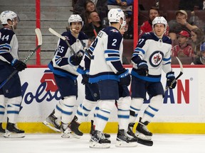 Winnipeg Jets left wing Nikolaj Ehlers (27) celebrates with team his goal scored in the first period against the Ottawa Senators at the Canadian Tire Centre in Ottawa on Sunday, April 10, 2022.
