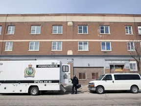 Winnipeg Police Service forensics unit at an apartment block on Sargent Avenue in Winnipeg on Tues., April 19, 2022, where a man was shot and killed on Monday.  KEVIN KING/Winnipeg Sun/Postmedia Network