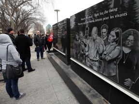 People check out the Workers Memorial during a ceremony for its official unveiling at Memorial Park in Winnipeg on Thurs., April 28, 2022.  KEVIN KING/Winnipeg Sun/Postmedia Network