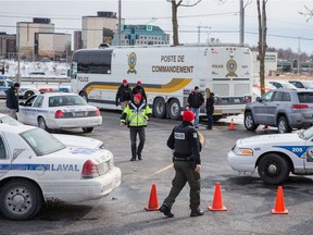 Sûreté du Québec and Laval police at Carrefour Multisports in Laval, the scene where 50-year-old Lorenzo Giordano was killed in March 2016.