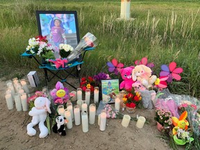 Photos of three-year-old Jemimah Bunadalian sit near candles during a vigil for the Winnipeg girl on July 10, 2021 in this handout photo provided May 26, 2022. Her father, Frank Nausigimana, 29, pleaded guilty to second-degree murder for her killing.