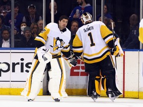 Louis Domingue of the Pittsburgh Penguins comes in during the second overtime period to take over goaltending duties from Casey DeSmith against the New York Rangers.