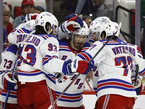 Chris Kreider (20) of the New York Rangers reacts with his teammates following a third period goal in Game 7 of the Second Round of the 2022 Stanley Cup Playoffs against the Carolina Hurricanes at PNC Arena on May 30, 2022 in Raleigh, N. C.