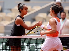 Martina Trevisan of Italy interacts with Leylah Fernandez of Canada after winning their Women's Singles Quarter Final match on Day 10 of The 2022 French Open at Roland Garros on May 31, 2022 in Paris, France.