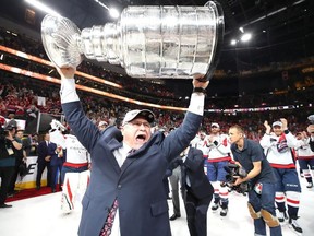 Head coach Barry Trotz of the Washington Capitals hoists the Stanley Cup after his team defeated the Vegas Golden Knights 4-3 in Game Five of the 2018 NHL Stanley Cup Final at T-Mobile Arena on June 7, 2018 in Las Vegas, Nevada.