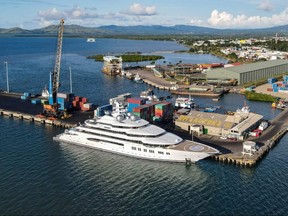 A photo taken on April 13, 2022 shows the superyacht Amadea, reportedly owned by a Russian oligarch, berthed at the Queens Wharf in Lautoka. - Fijian authorities on April 19 applied to block a superyacht reportedly owned by Russian oligarch Suleiman Kerimov from leaving its waters, as the United States moved to seize it due to US and European Union sanctions over Russia's invasion of Ukraine. Leon LORD / FIJI SUN / AFP