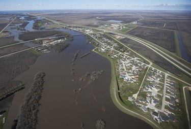 St Agathe, Man., is protected against Red River flooding by a dike south of Winnipeg, Sunday, May 15, 2022. John Woods/Pool/The Canadian Press
