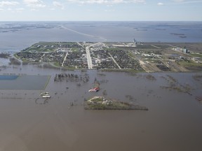 The town of Morris, Man., has closed it’s dikes due to result of Red River flooding south of Winnipeg, Sunday, May 15, 2022. John Woods/Pool/The Canadian Press