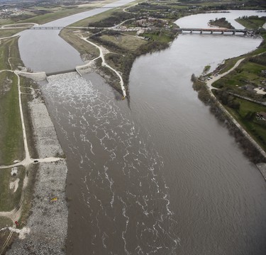 The Winnipeg Floodway outlet, left and the Red River just north of Winnipeg, Sunday, May 15, 2022. The floodway is used to divert Red River flood water around the city of Winnipeg. John Woods/Pool/The Canadian Press