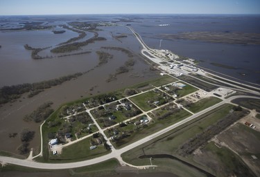 The Canada/US border crossing near Emerson, Man., is surrounded by water as a result of Red River flooding south of Winnipeg, Sunday, May 15, 2022. John Woods/Pool/The Canadian Press