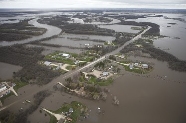 St Mary’s Road, which runs between Winnipeg and St Adolphe, Man., is closed due to Red River flooding south of Winnipeg, Sunday, May 15, 2022. John Woods/Pool/The Canadian Press