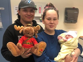 Mitchell Muskego and Christian Danis with baby Dylan. While responding to a call for service on Friday, May 20, 2022, Const. Dylan Fedrau and Const. Lindsay Bawn of the Norway House RCMP Detachment entered a residence in Kinosao Sipi First Nation to find a mother in labour. They jumped into action to assist her. Bawn cared for the mother and Fedrau delivered the baby. Mother and baby are doing well, as is the very proud father. RCMP officers visited the family and took the new baby a RCMP stuffed animal and a blanket. They also learned the name of the baby – Dylan, after Fedrau.