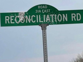 A picture found online shows damage done by bullets to the Reconciliation Road sign in St. Clements, and some are now wondering if the damage was an act of racism. Facebook photo.
