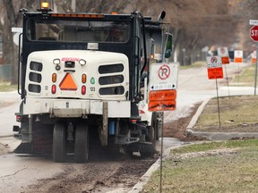 Street-cleaning operations on Guelph Street near Corydon Avenue in Winnipeg on Mon., April 26, 2021. The annual city-wide spring cleanup operation is slated to begin Sunday, May 1 at 10 p.m.