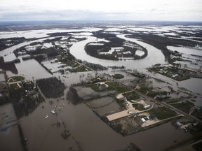 The Red River overflows its banks south of Winnipeg, Sunday, May 15, 2022.