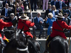 Prince Charles and Camilla, Duchess of Cornwall watch a performance of the RCMP Musical Ride in Ottawa, during their Canadian Royal tour, on Wednesday, May 18, 2022.