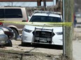 Police near a house in the 400 block of Young Street in Winnipeg on Thursday, May 5, where a deceased person was found outside the night before. A 53-year-old man was arrested in Toronto and charged for the May 4 murder of 39-year-old Scott Matthew Catcheway in Winnipeg.