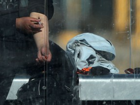 A person injects an unknown substance into their arm