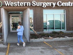 A woman enters the Western Surgery Centre on Larimer Boulevard, one of two places in Winnipeg performing cataract surgeries, on Mon., May 9, 2022.  KEVIN KING/Winnipeg Sun/Postmedia Network