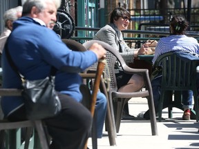 People sit on a patio at Bar Italia on Corydon Avenue in Winnipeg on Tue., May 10, 2022.