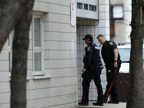 Police at a Manitoba Housing building on Kennedy Street  on Thursday, May 19, 2022 where a deceased woman was found. The death is considered suspicious, and the Homicide Unit has taken over the investigation.