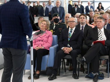 Lt.-Gov. Janice Filmon (left), her husband Gary (centre) and Terry Slobodian, president/CEO of Royal Aviation Museum of Western Canada listen during the museum grand opening ceremony at the Winnipeg International Airport on Thurs., May 19, 2022.  KEVIN KING/Winnipeg Sun/Postmedia Network
