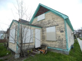The remains of eight dogs were discovered in this boarded up home in the 1400 block of Ross Ave West in Winnipeg.  The incident is now  described an an animal cruelty investigation Winnipeg Police said Saturday.