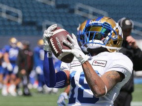 Receiver Jalen Saunders grips a ball that fell just out of his reach during Winnipeg Blue Bombers training camp on Sunday, May 22, 2022.