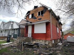 A vacant, two-storey home on Arlington Street in Winnipeg that caught fire late Sunday is pictured on Monday. A firefighter was taken to hospital after being injured in the fire that broke out at just before midnight on Sunday.