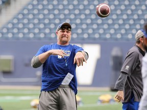 Head coach Mike O'Shea plays catch with players at Winnipeg Blue Bombers training camp on Wednesday, May 25, 2022.