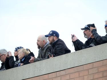 Spectators watch motorcyclists participate in the 14th Motorcycle Ride for Dad in Winnipeg on Saturday, May 28, 2022.