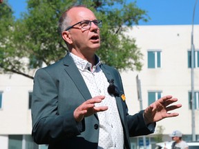 Winnipeg mayoral candidate Shaun Loney speaks at an event outside the Thunderbird House on the corner of Higgins and Main proposing a plan to address homelessness in the city on Monday, June 27.