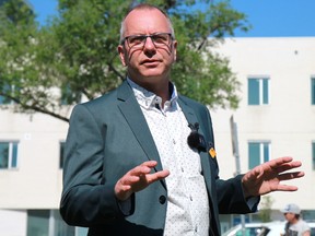 Winnipeg mayoral candidate Shaun Loney speaks at an event outside the Thunderbird House on the corner of Higgins and Main proposing a plan to address homelessness in the city on Monday, June 27.