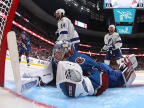 Darcy Kuemper of the Colorado Avalanche dives across the crease during overtime against the Tampa Bay Lightning in Game One of the 2022 Stanley Cup Final at Ball Arena on June 15, 2022 in Denver, Colorado.