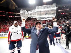 Barry Trotz holds up the Stanley Cup he won with the Capitals in 2018. Are signs pointing to him joining the Jets? GETTY IMAGES