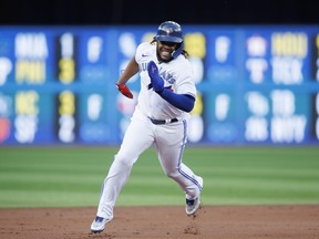 Vladimir Guerrero Jr. of the Toronto Blue Jays rounds the bases en route to scoring on a double off the bat of Alejandro Kirk in the first inning against the Baltimore Orioles at Rogers Centre on June 15, 2022 in Toronto.