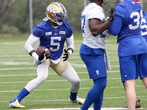 Winnipeg Blue Bombers defensive end Willie Jefferson (left) comes down with the ball during short kickoff practice in Winnipeg on Tues., June 14, 2022.