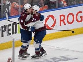 J.T. Compher (37) of the Colorado Avalanche celebrates his third period goal with teammate Bowen Byram (4) against the Edmonton Oilers in Game 3 of the Western Conference Final of the 2022 Stanley Cup Playoffs at Rogers Place on June 4, 2022 in Edmonton.