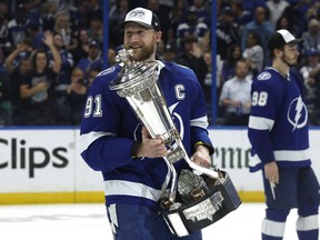 Tampa Bay Lightning center Steven Stamkos (91) smiles as he holds the Prince of Wales Trophy after defeating the New York Rangers in Game 6 of the Eastern Conference Final of the 2022 Stanley Cup Playoffs at Amalie Arena in Tampa, Fla., on Saturday, June 11, 2022.