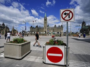 Signs are pictured on Parliament Hill prior to Canada Day, in Ottawa, Monday, June 27, 2022.