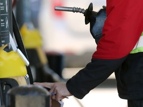 An attendant at the gas pump in south Winnipeg as prices  spike again in Winnipeg on Wed., June 1, 2022.  KEVIN KING/Winnipeg Sun/Postmedia Network