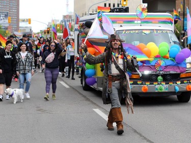 Capt. Jack Sparrow carries a bottle of rum during the Pride Winnipeg parade through downtown on Sunday, June 5, 2022.