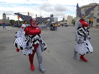 Pictoria Secrete (right) and Gloria Booths walk the Pride Winnipeg parade through downtown on Sunday, June 5, 2022.