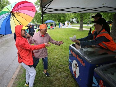 Sargent Sundae hands out treats for damp participants in the 26th annual Cruisin' Down the Crescent fundraising event for the Rehabilitation Centre for Children on Wellington Crescent in Winnipeg on Sunday, June 12, 2022. Returning from a two-year break due to the COVID-19 pandemic, the event supports programs, equipment, technology and research for children and youth living with physical and developmental disabilities.