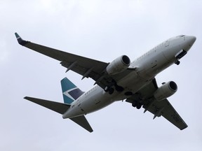 A passenger jet in flight over Winnipeg on Thursday, June 16. 2022. Chris Procaylo/Winnipeg Sun
