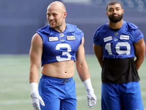 Defensive end Thiadric Hansen (left) with linebacker Kyrie Wilson during Bombers practice in June. Both were among five Bombers to suffer Achilles tears this past season.